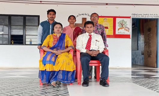 Principal with the school staff